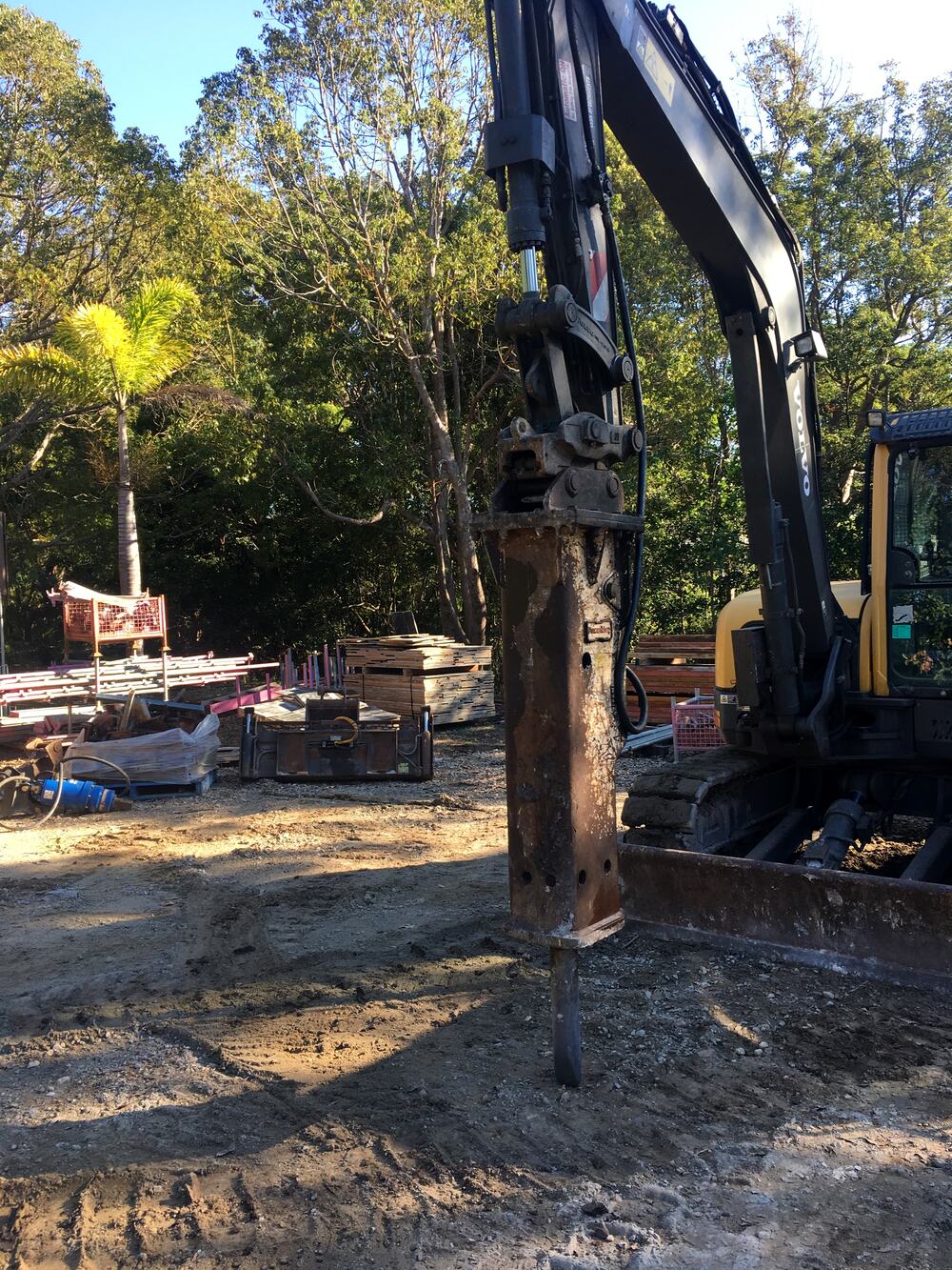 Rock breaker attachment working on a site excavation