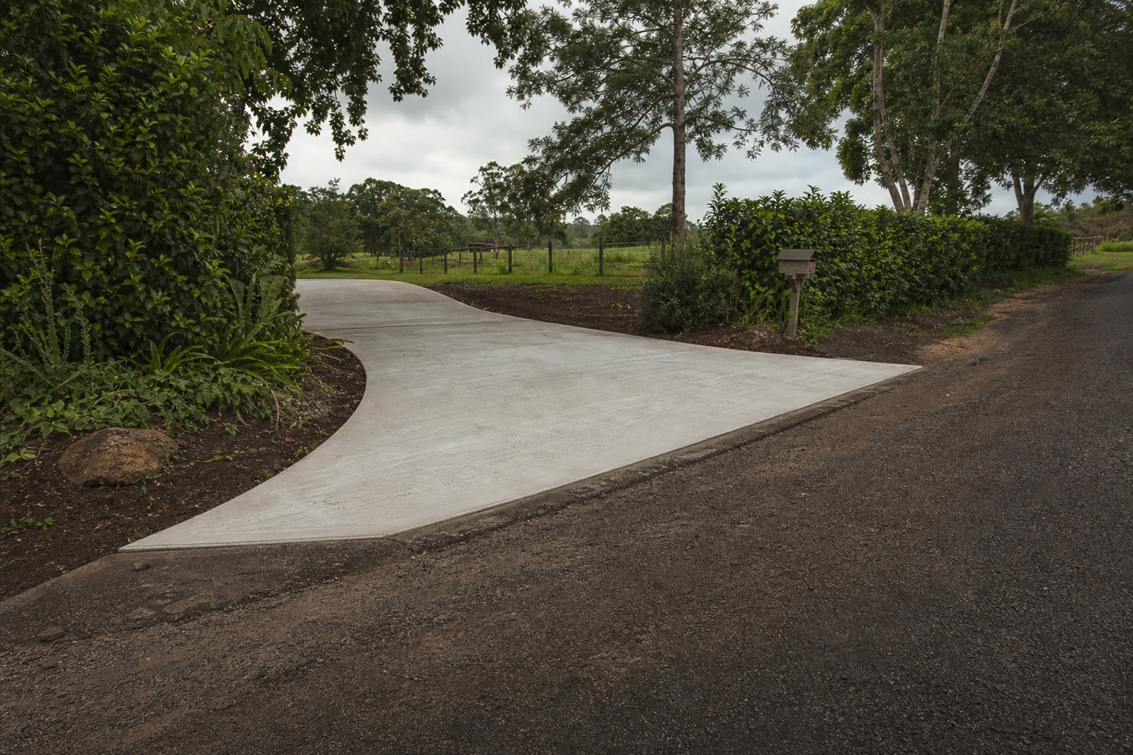 New driveway crossover meeting a country road